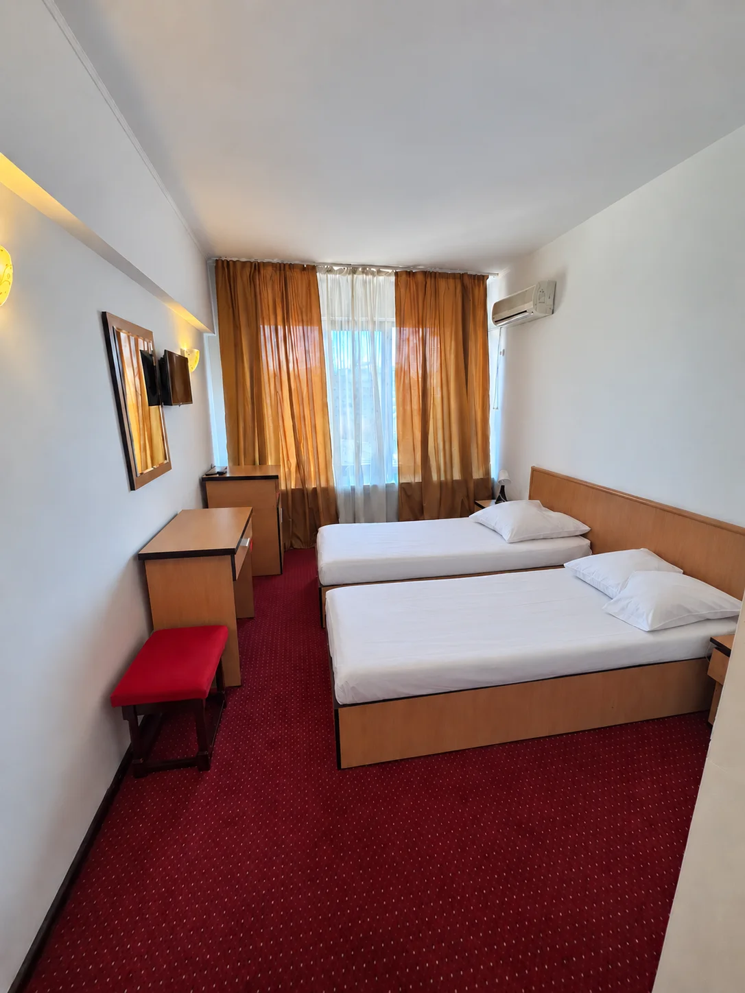 Twin beds — red carpet